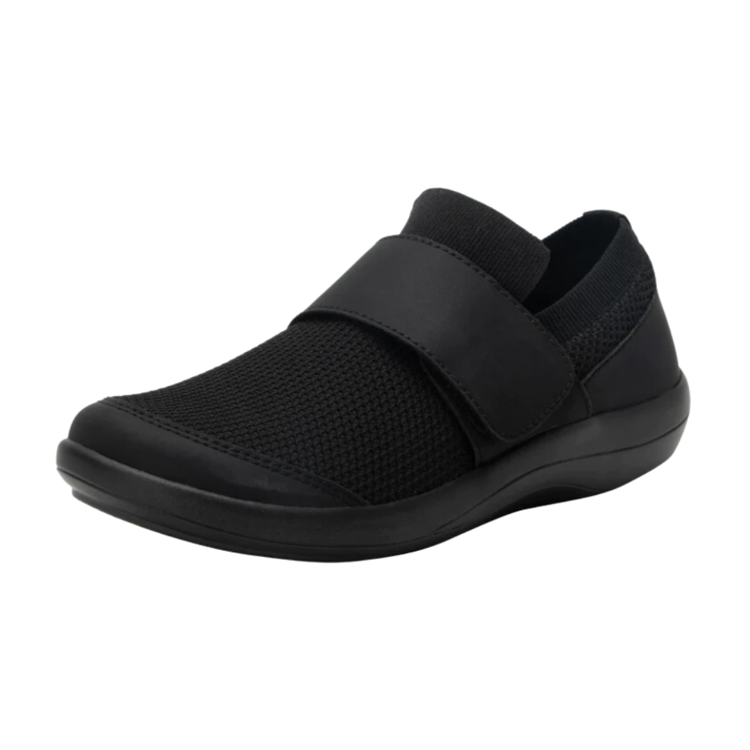 Side View of Women’s Alegria Dasher sneaker in Black Out – featuring a cushioned removable footbed, slip-on design, and slip-resistant outsole for secure all-day wear.