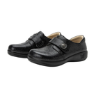 Angled view of Women’s Alegria Joleen casual slip-on in all black – featuring smooth leather upper, cushioned insole, elastic gore panels, and flexible outsole.