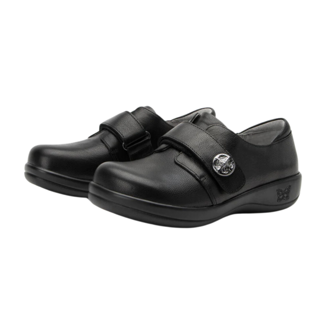 Angled view of Women’s Alegria Joleen casual slip-on in all black – featuring premium leather, padded collar, memory foam footbed, and slip-on design for easy wear.
