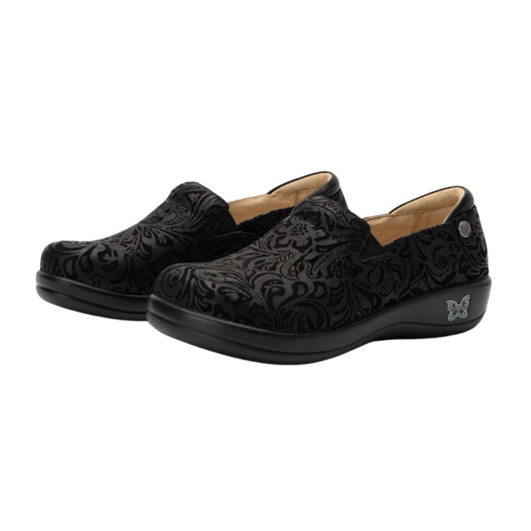Angled view of Women’s Alegria Keli casual slip-on in all black – featuring a soft leather upper, cushioned footbed, slip-on design with elastic gore panels for easy on and off.