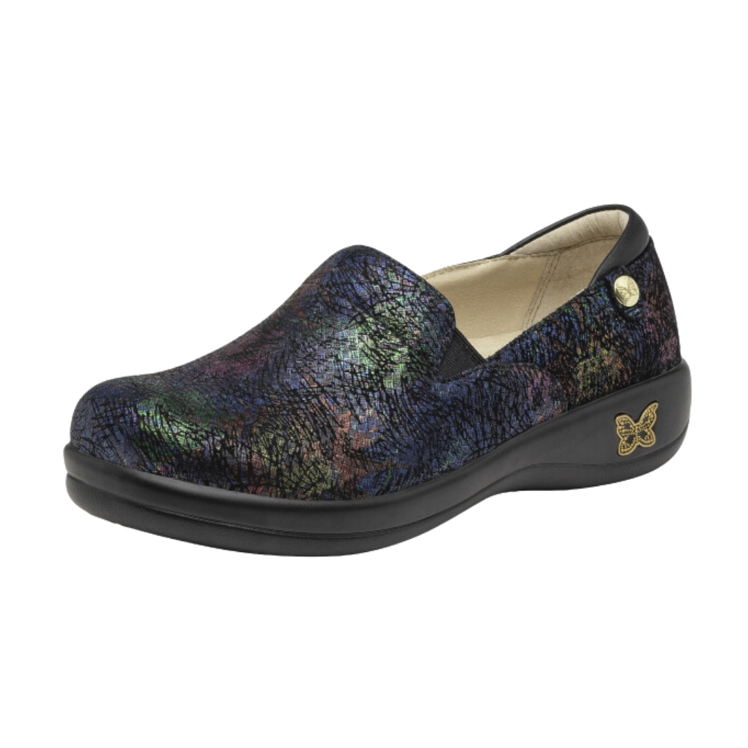 Angled view of Women’s Alegria Keli casual slip-on in black with multi-colors – featuring a vibrant printed upper, padded collar, and memory foam footbed for all-day comfort.