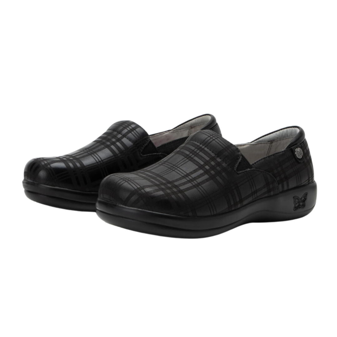 Side view of Women’s Alegria Keli casual shoe in all black – showing lightweight slip-on design with stretch panels for easy fit, cushioned and contoured footbed for comfort, breathable upper materials, and flexible outsole for natural movement.