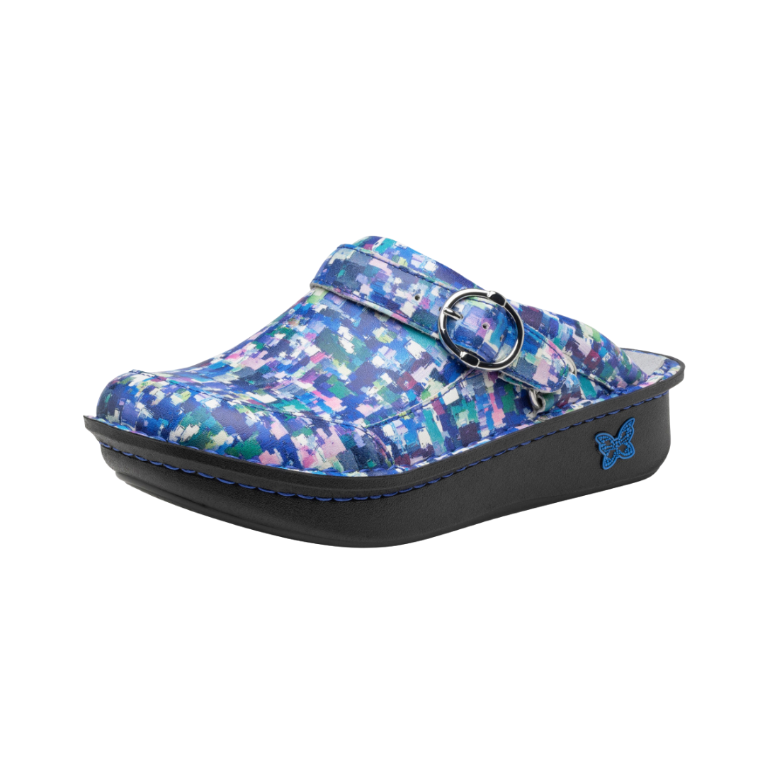 Side View of Women’s Alegria Seville clog in Welcome Back Blotter blue print – featuring a cushioned cork and memory foam footbed, swivel strap with adjustable buckle, and slip-resistant outsole for all-day comfort.