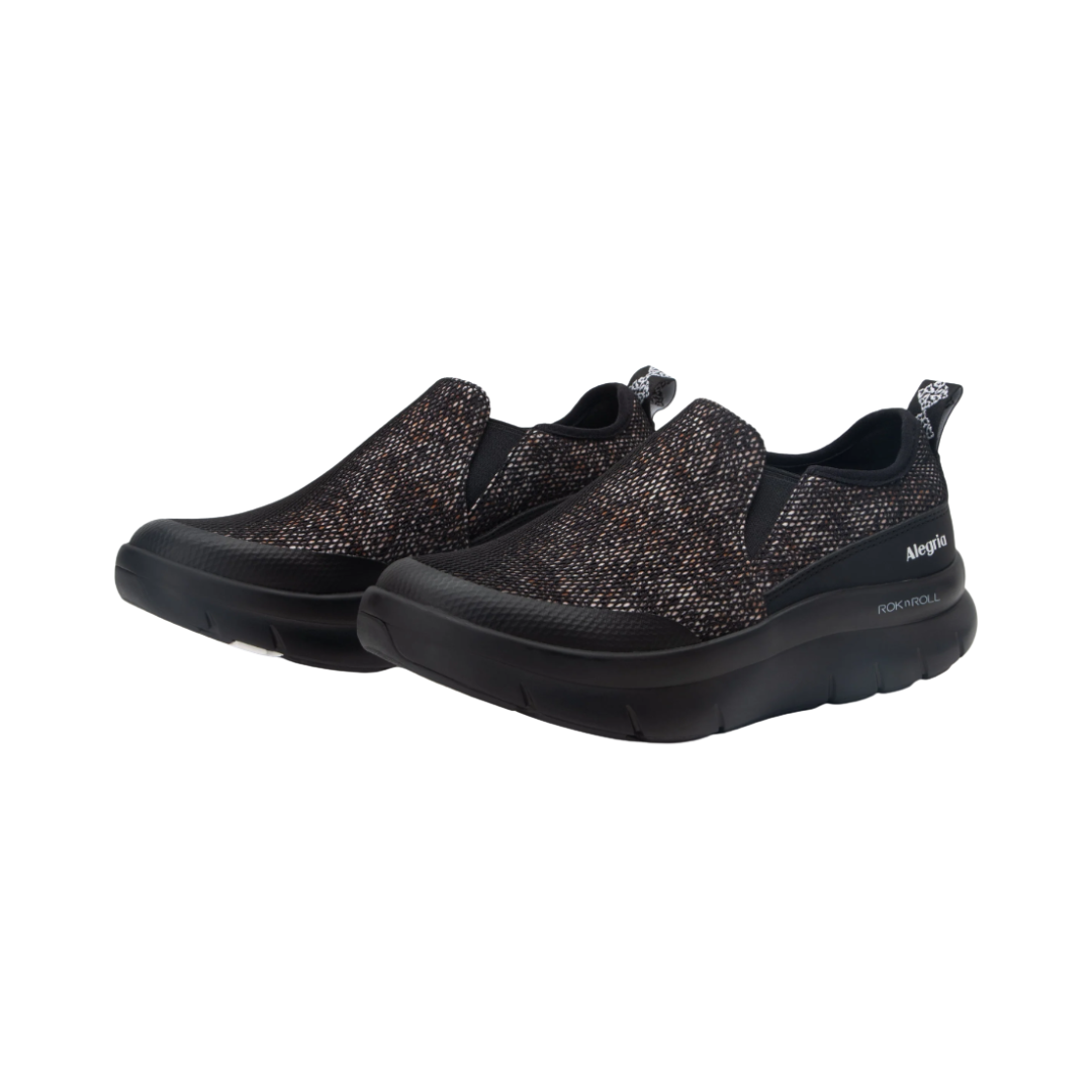 Side View of Women’s Alegria Shift Lead shoe in Creature Comfort black – featuring a cushioned removable footbed, slip-on design, and slip-resistant outsole for all-day support.