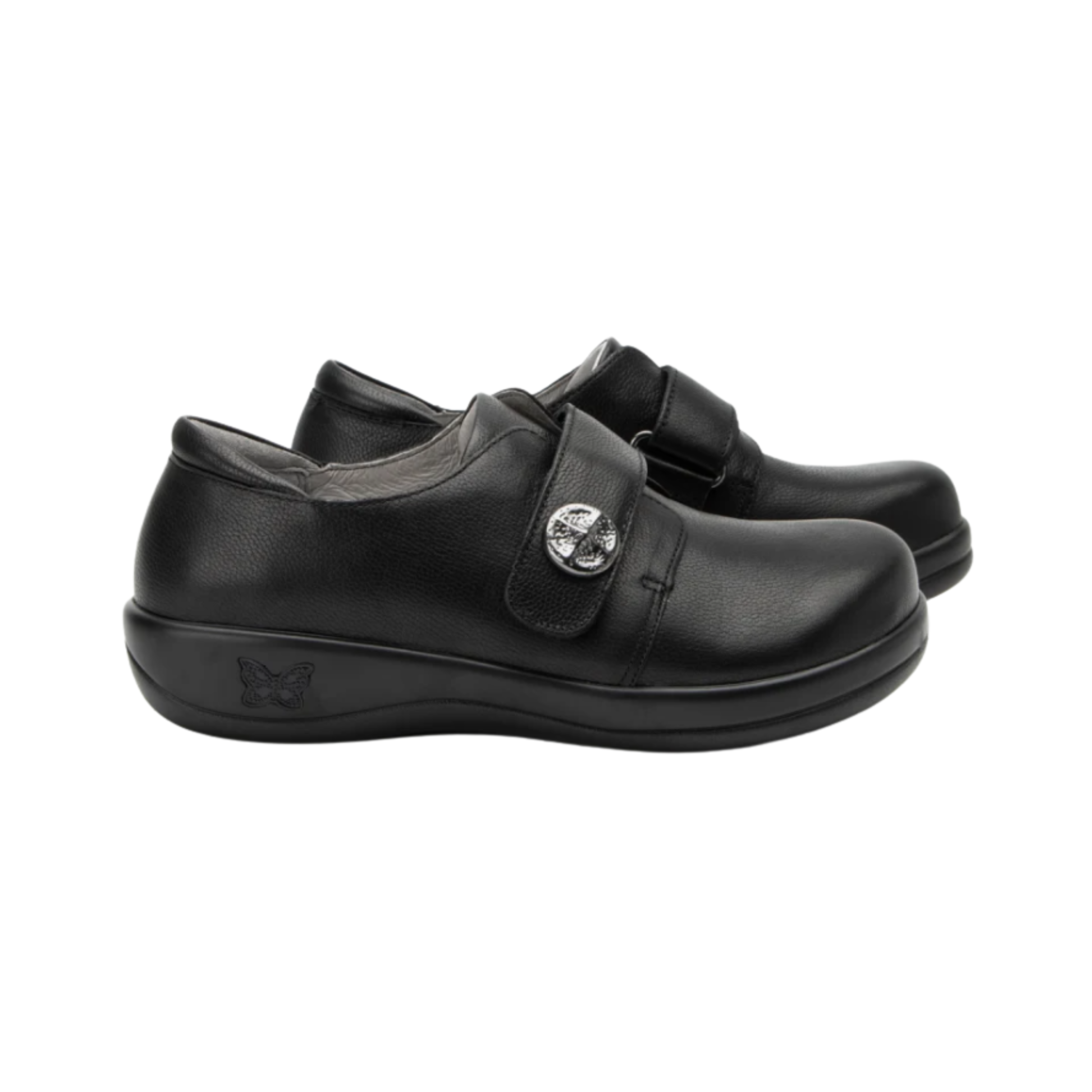Side View of Women’s Alegria Joleen Work shoe in Upgrade Black – featuring a rocker outsole that promotes natural movement and reduces pressure on joints, a secure hook-and-loop strap for a personalized fit, and a clean, minimalist leather finish ideal for professional environments.