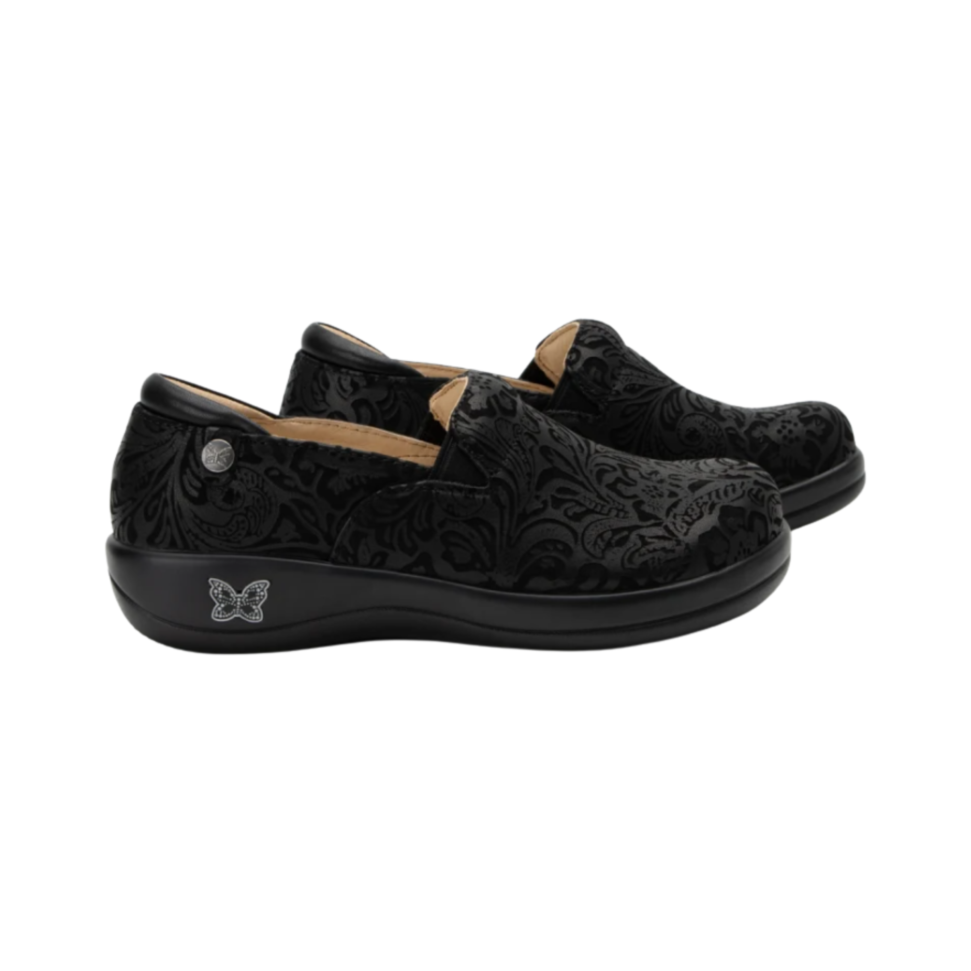 Side View of Women’s Alegria Keli Black Emboss Paisley slip-on shoe in black embossed paisley leather – featuring double elastic side gores for easy entry, slip-resistant outsole for enhanced traction, and supportive rocker bottom for natural stride.