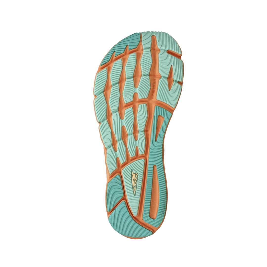 Bottom view of women’s Altra Torin 6 in White/Orange – Featuring a responsive cushioning system for comfort, a durable rubber outsole for traction, and a smooth, flexible design for natural foot movement.