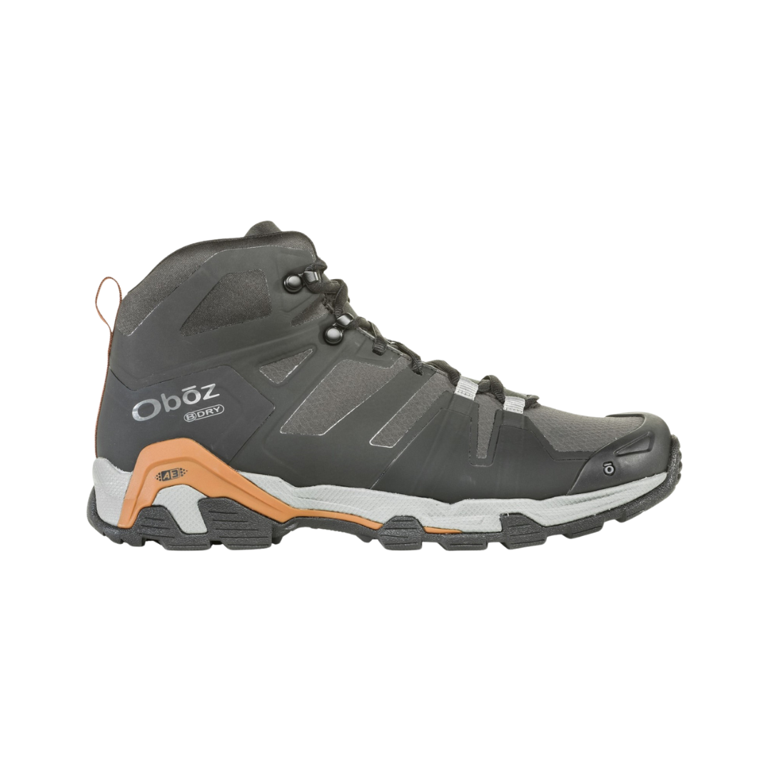 Side view of Men's Arete Mid B-Dry Boot in Black/Copper – featuring a lightweight synthetic and mesh upper with B-Dry waterproof technology, cushioned midsole for responsive support, and a grippy outsole designed for agile performance on the trail.
