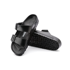 Angled view of Men’s Birkenstock Arizona Essential EVA 2-strap sandal in all black – showcasing waterproof EVA material with a contoured footbed for lightweight comfort.
