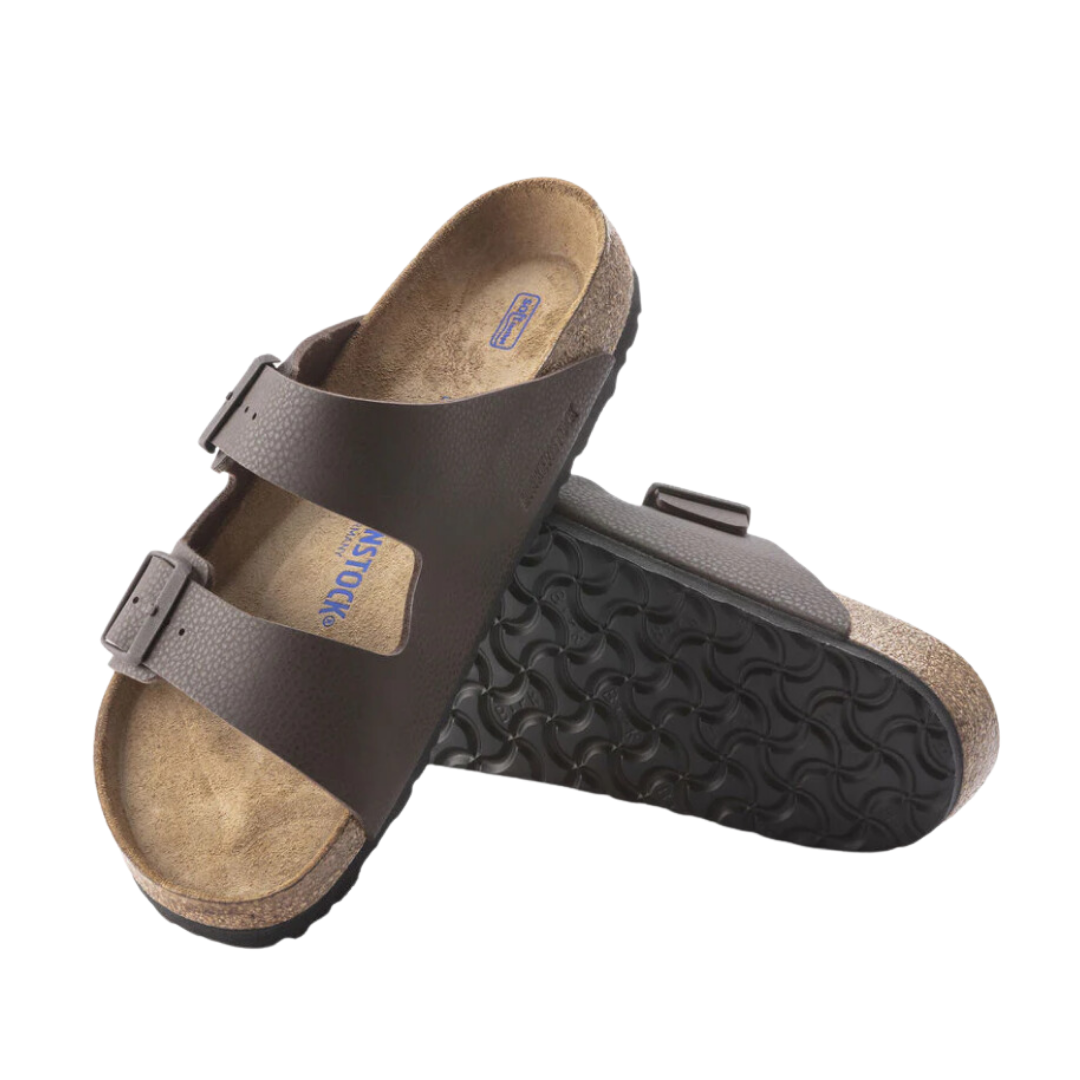 Angled view of Men’s Birkenstock Arizona Soft Footbed sandal in chocolate brown – with Birko-Flor upper and cork footbed for soft cushioning.