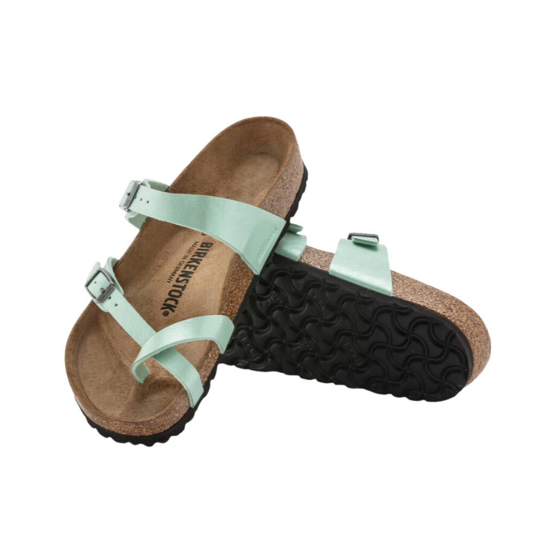 Angled view of Women’s Birkenstock Mayari Birko-Flor sandal in light green - featuring a Birko-Flor upper, adjustable toe strap, and cork footbed for all-day comfort.