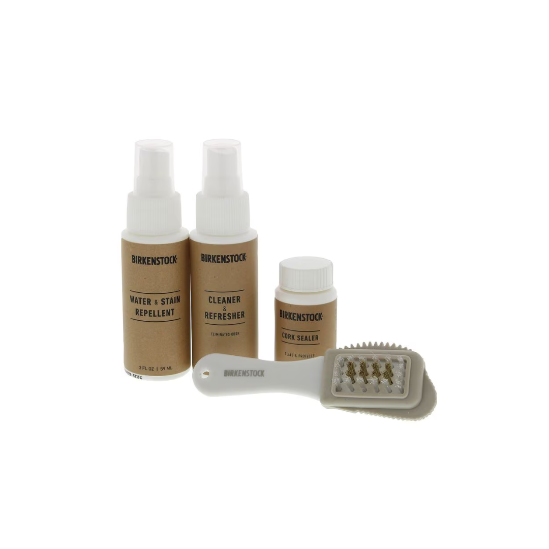 Front view of the Birkenstock Deluxe Shoe Care Kit – featuring a comprehensive set including a premium suede brush, natural cork cleaner, moisturizing leather balm, and a soft polishing cloth, all designed to clean, nourish, and protect your Birkenstock footwear for long-lasting comfort and durability.
