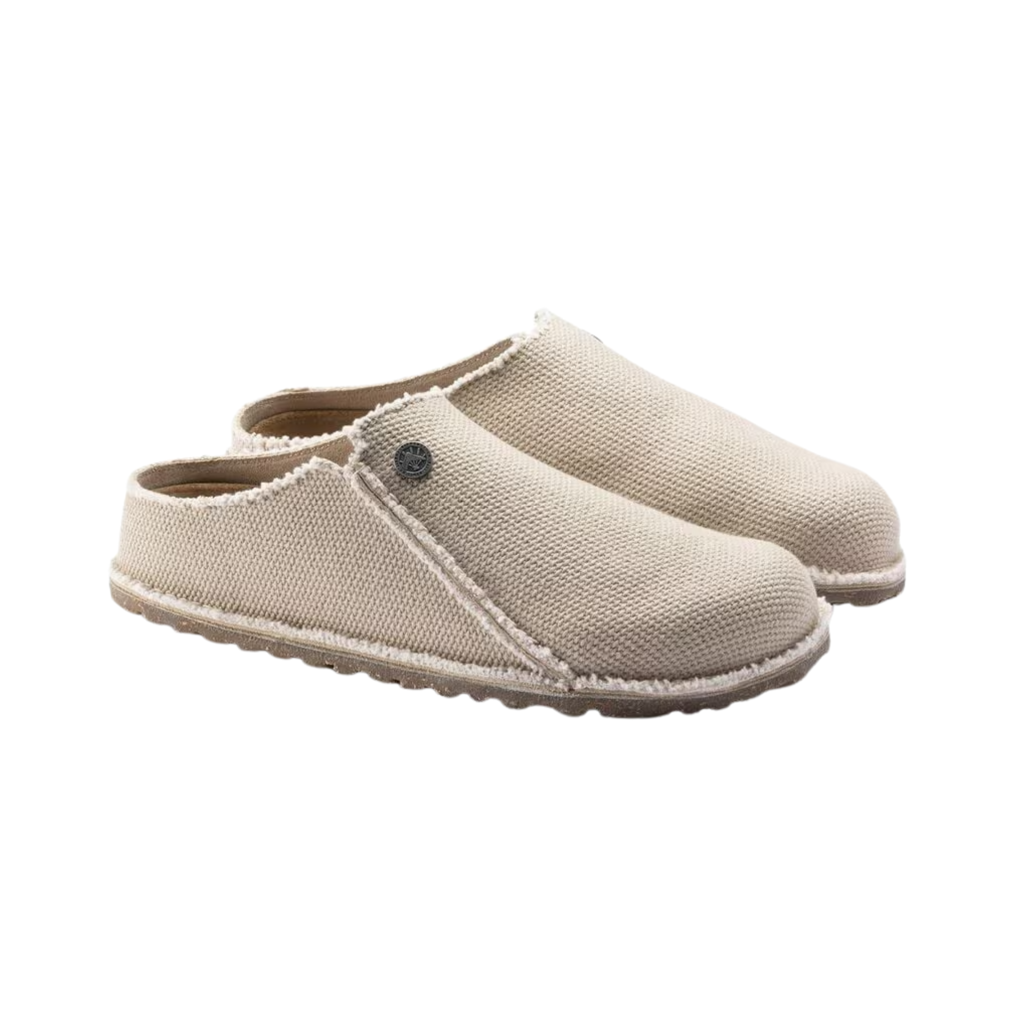 Side View of Women’s Birkenstock Zermatt Canvas Textile slipper in eggshell – featuring a soft canvas upper, anatomically shaped cork-latex footbed for support, and textured rubber outsole for indoor and light outdoor use.