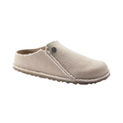 Side View of Women’s Birkenstock Zermatt Canvas Textile slipper in eggshell – featuring a minimalist canvas upper, contoured cork-latex footbed for all-day comfort, and flexible rubber outsole for light traction.