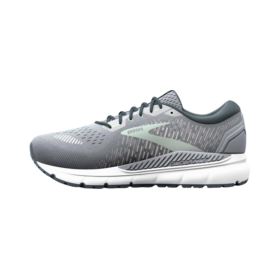 Side view of Women’s Brooks Addiction GTS 15 running shoe in grey, navy, and aqua – featuring engineered mesh upper for breathability, GuideRails support system for stability, and BioMoGo DNA midsole for adaptive cushioning.