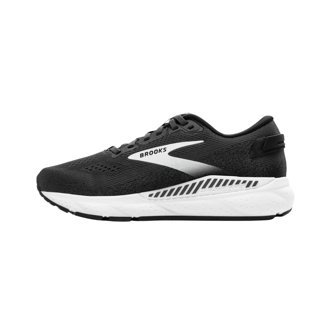 Side view of Women’s Brooks Ariel GTS 24 running shoe in ebony, black, and white – featuring engineered mesh upper for breathability, GuideRails support system to stabilize the foot and reduce excess movement, and BioMoGo DNA midsole for adaptive cushioning and shock absorption.