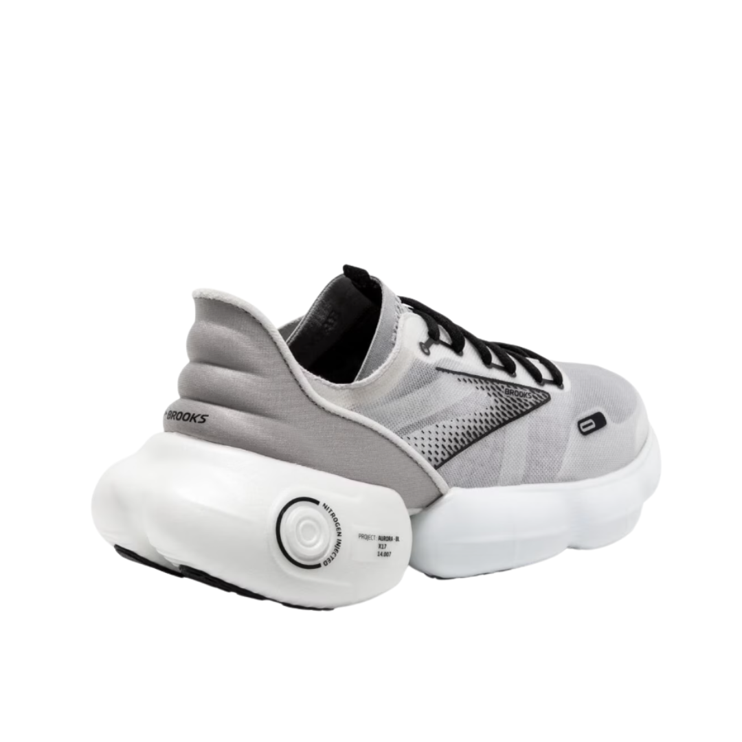 Angled View of Women’s Brooks Aurora-BL running shoe in white alloy black – featuring a breathable mono-mesh upper, nitrogen-infused DNA LOFT v3 midsole for ultra-soft cushioning, and unique decoupled design for smooth heel-to-toe transitions.