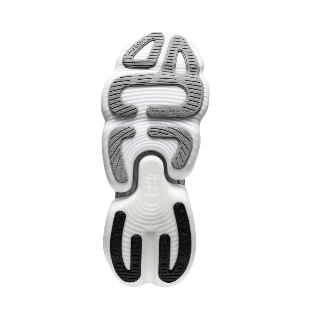 Bottom View of Women’s Brooks Aurora-BL running shoe in white alloy black – featuring a durable rubber outsole with decoupled midsole design, strategic flex zones for enhanced flexibility, and textured tread for reliable traction.
