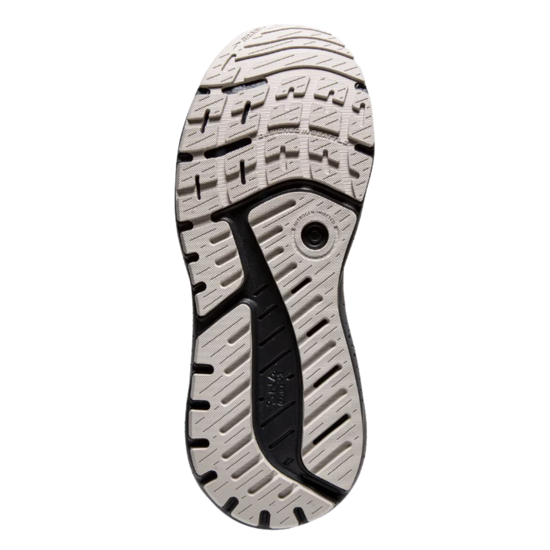 Bottom view of Men’s Brooks Beast GTS 23 in Grey/Scarlet/Ebony – featuring a durable rubber outsole with strategic tread patterns for reliable traction on various surfaces.