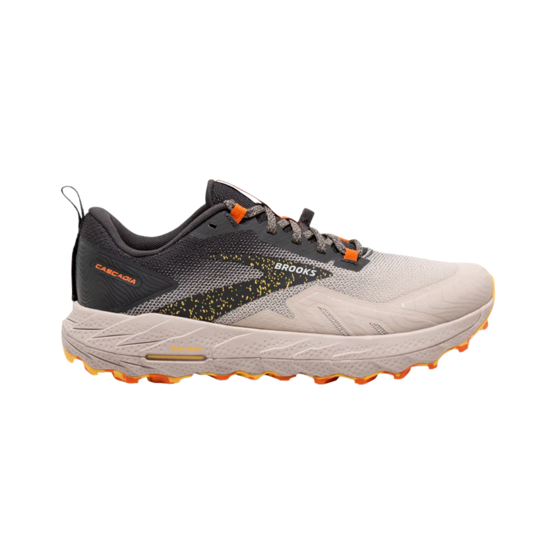 Side view of the men’s Brooks Cascadia 17 trail running shoe in Chateau Grey/Forged Iron, featuring adaptive cushioning, protective trail-ready construction, and grippy TrailTack outsole for stability on rugged terrain; supportive design ideal for hikers and runners.