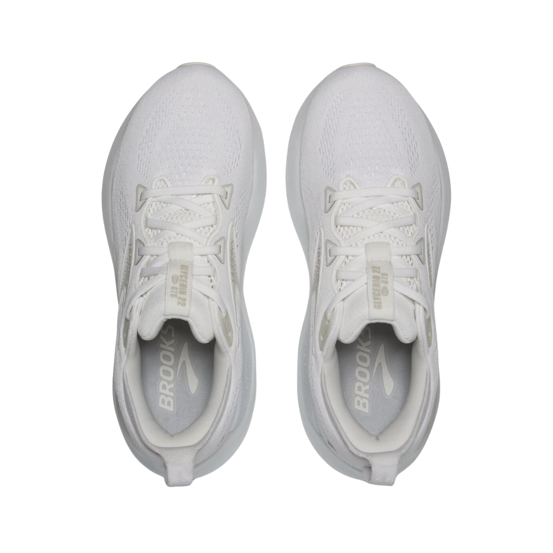 Top view of Women’s Brooks Glycerin GTS 22 running shoe in white, white, and grey – featuring padded tongue and collar for comfort, moisture-wicking lining to keep feet dry, and secure lace-up closure for locked-in fit.