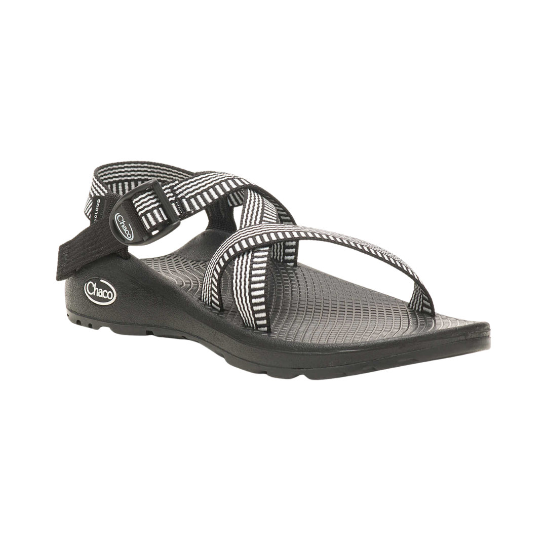 Side view of Women’s Chaco Z/Cloud 2 sandal in black and white – featuring polyester jacquard webbing upper, injection-molded ladder lock buckle, and ChacoGrip™ rubber outsole for enhanced traction.