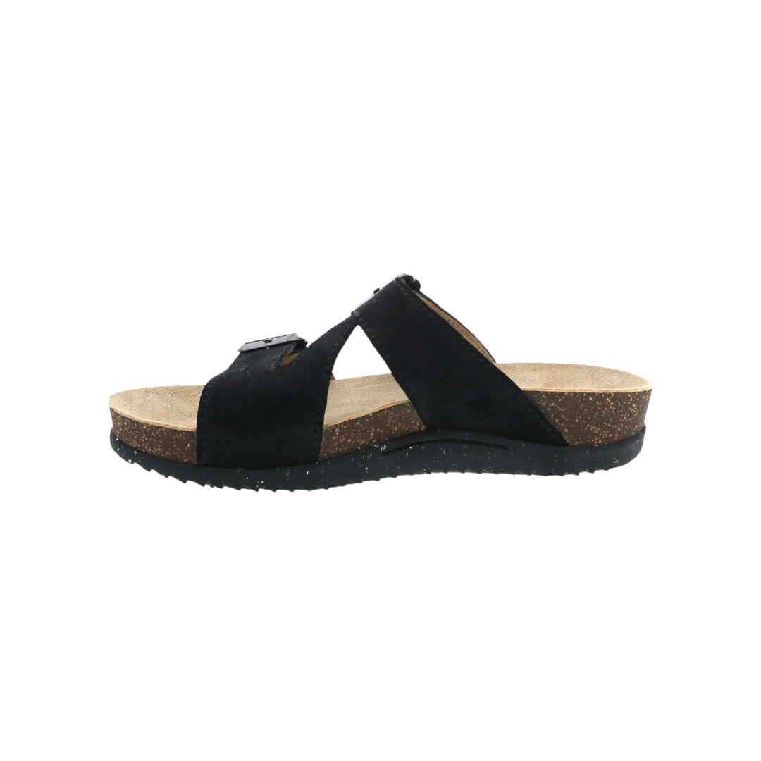 Side view of Women’s Dansko Dayna sandal in black suede – featuring a low wedge heel, lightweight EVA outsole, and soft suede upper for stylish comfort.