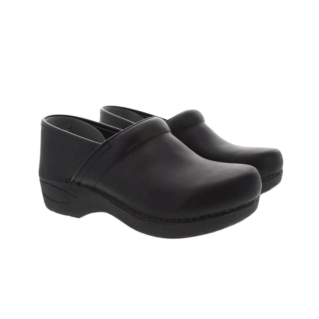 Side  view of Women’s Dansko Pro XP 2.0 clog in black waterproof leather – featuring a rounded toe, smooth vamp, and clean design suitable for professional settings.