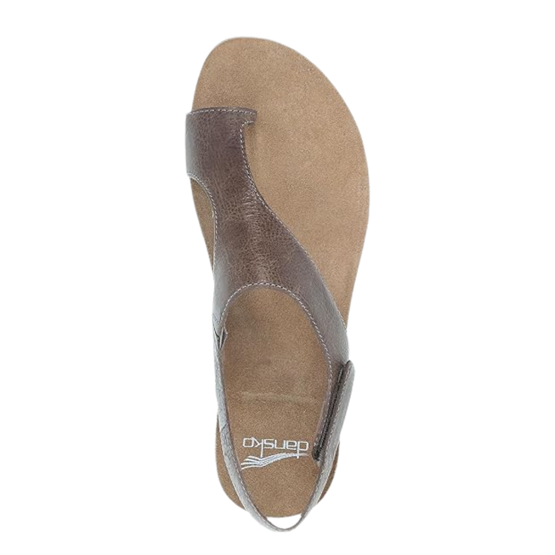 Top view of Women’s Dansko Reece sandal in stone waxy – featuring an open-toe design, hook-and-loop ankle strap, and smooth waxed leather footbed.