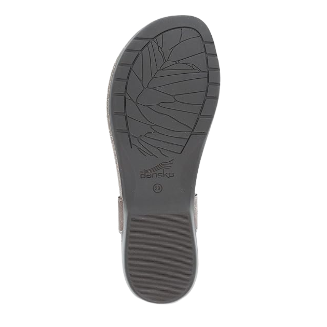 Bottom view of Women’s Dansko Reece sandal in stone waxy – featuring a rubber outsole with textured tread, lightweight construction, and flexible grooves.