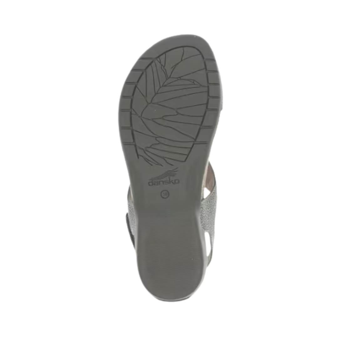 Bottom view of the Women’s Dansko Reece Sandal in Pewter Metallic, displaying the flexible, slip-resistant rubber outsole with a durable traction pattern. Designed for stability and everyday versatility during warm-weather activities and travel.