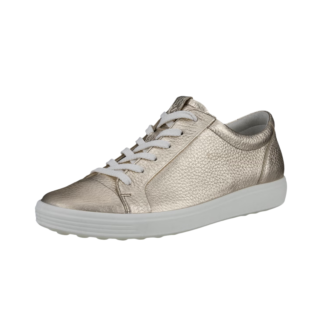 Angled View of Women’s ECCO Soft 7 Sneaker in Pure White/Gold – featuring sleek low-top silhouette, subtle gold accents for a touch of luxury, and minimalist design for everyday versatility.