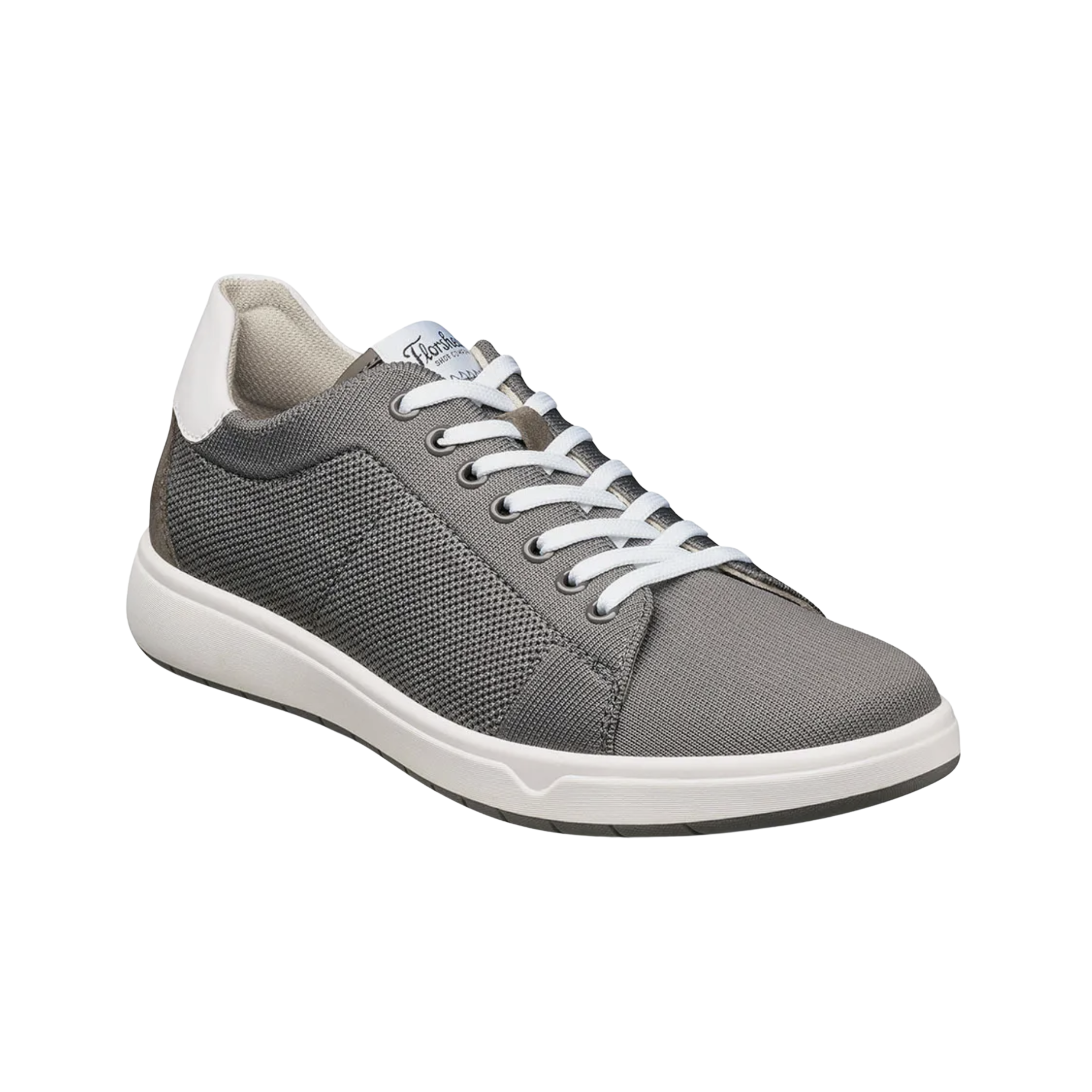 Angled view of Men’s Heist Knit Lace to Toe in Grey – capturing the seamless knit upper, ergonomic contouring, and casual sneaker style, ideal for travel, weekend wear, or daily low-impact activity.