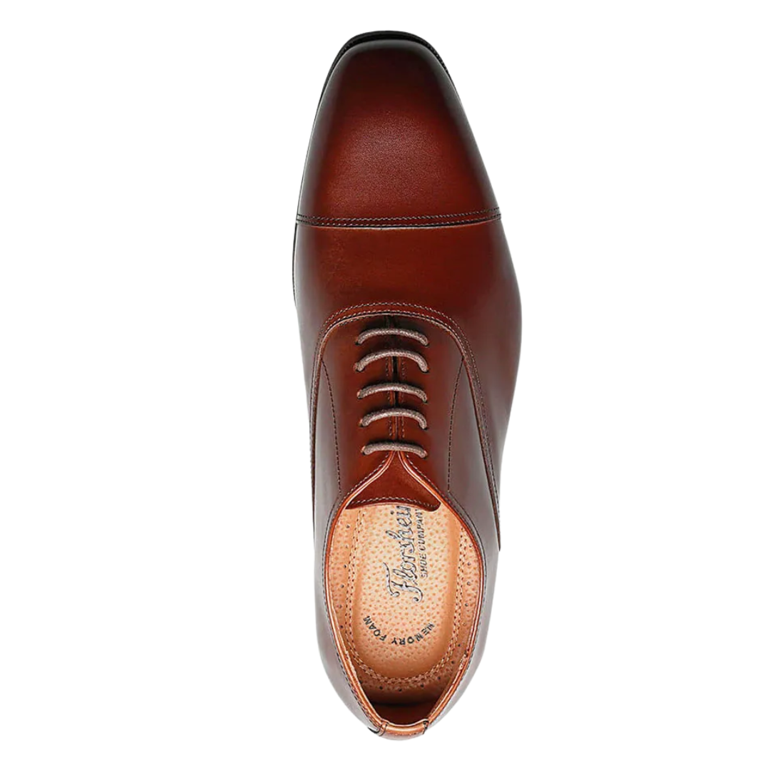 Top view of Men’s Florsheim Flex Cap-Toe Oxford in Cognac – highlighting the cap-toe line across the toe box, sleek lace-up closure, and premium leather construction in a rich cognac tone for timeless dress appeal.