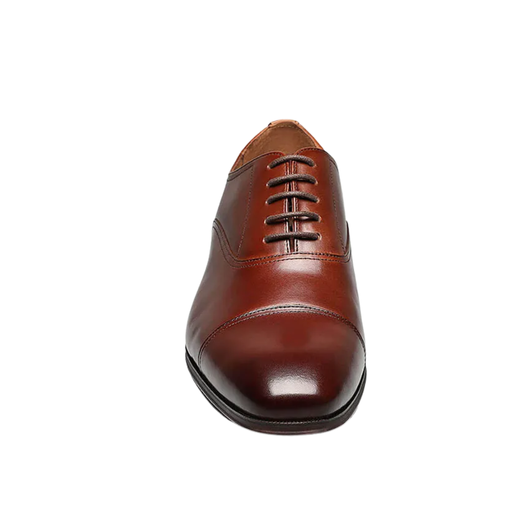 Front view of Florsheim Men’s Flex Cap-Toe Oxford in Cognac – featuring a polished leather upper with a structured cap-toe design, classic closed lacing, and minimal stitching for a clean, formal aesthetic.