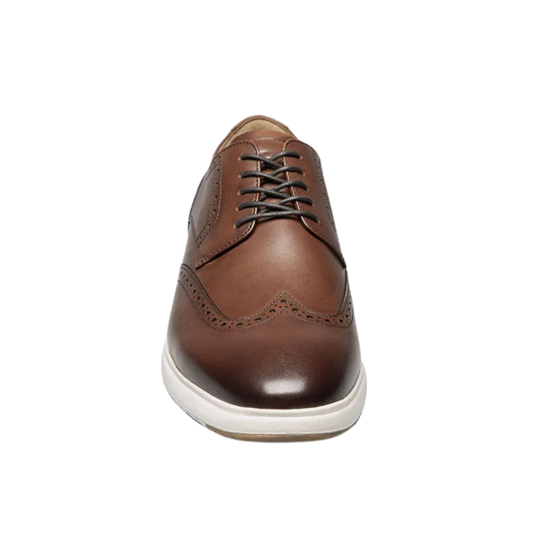 Front view of Men’s Dash Wing Tip in Cognac – featuring classic brogue detailing across the wingtip toe, traditional lacing system, and a rich leather finish for a polished yet heritage-inspired look.