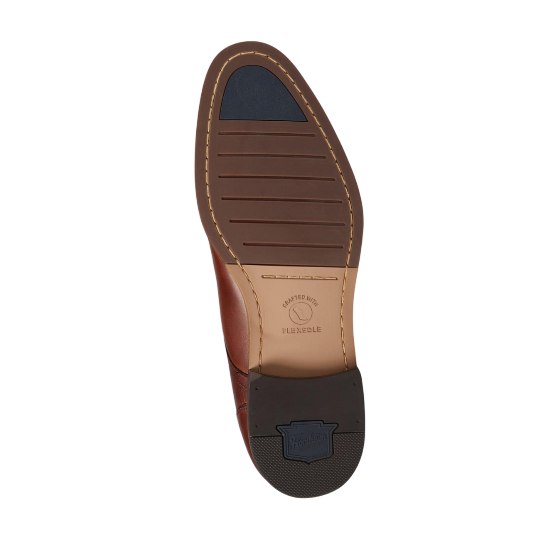 Bottom view of Men’s Flex Cap-Toe Oxford in Cognac – showcasing a flexible rubber outsole with light tread pattern, designed for enhanced grip and comfort while maintaining a low-profile dress shoe look.