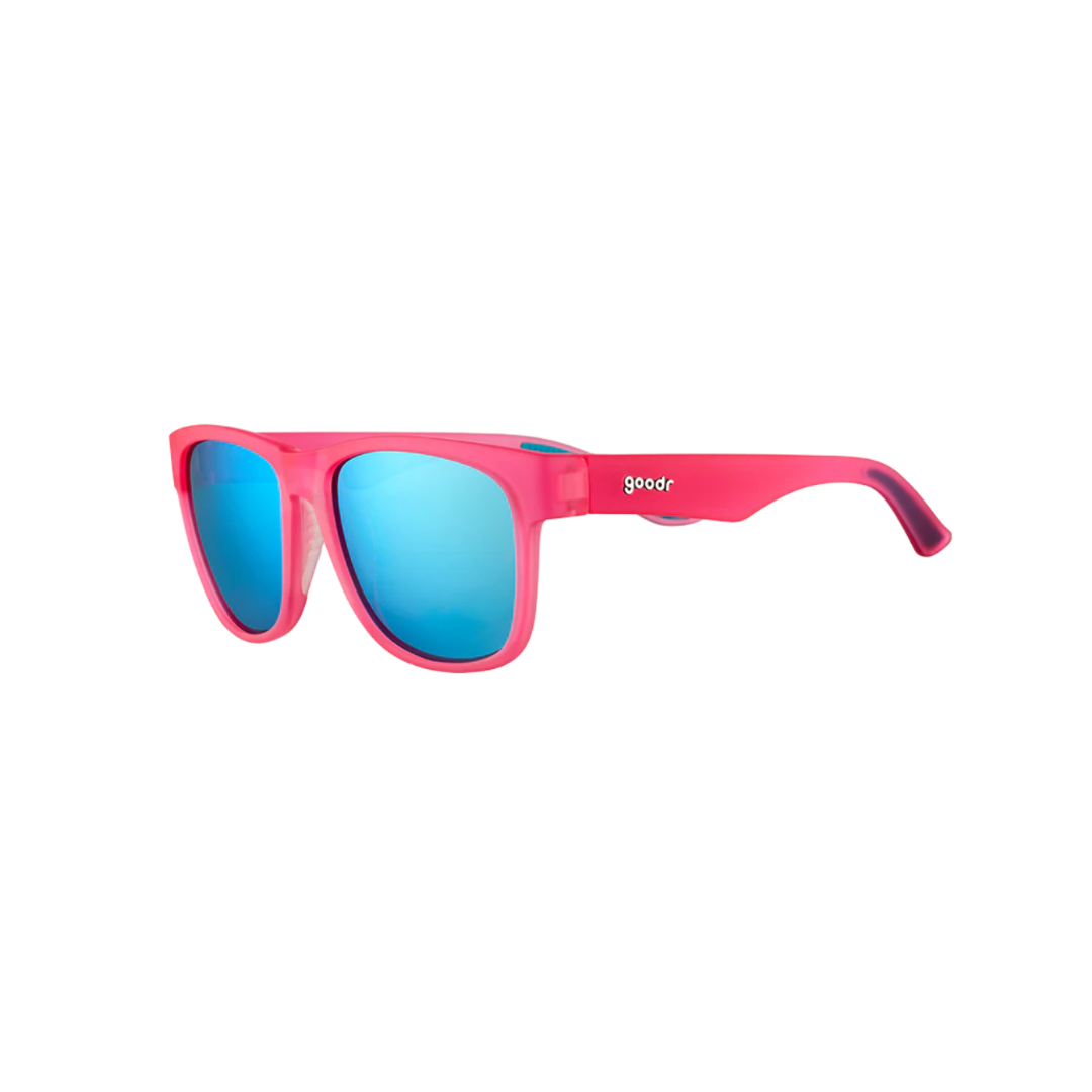 Angled View of Unisex Goodr BFG Sunglasses Do You Even Pistol Flamingo in Bright Pink Frame with Blue Mirrored Lenses – featuring oversized frame for wide coverage, polarized lenses for glare protection, and no-slip grips for active comfort.