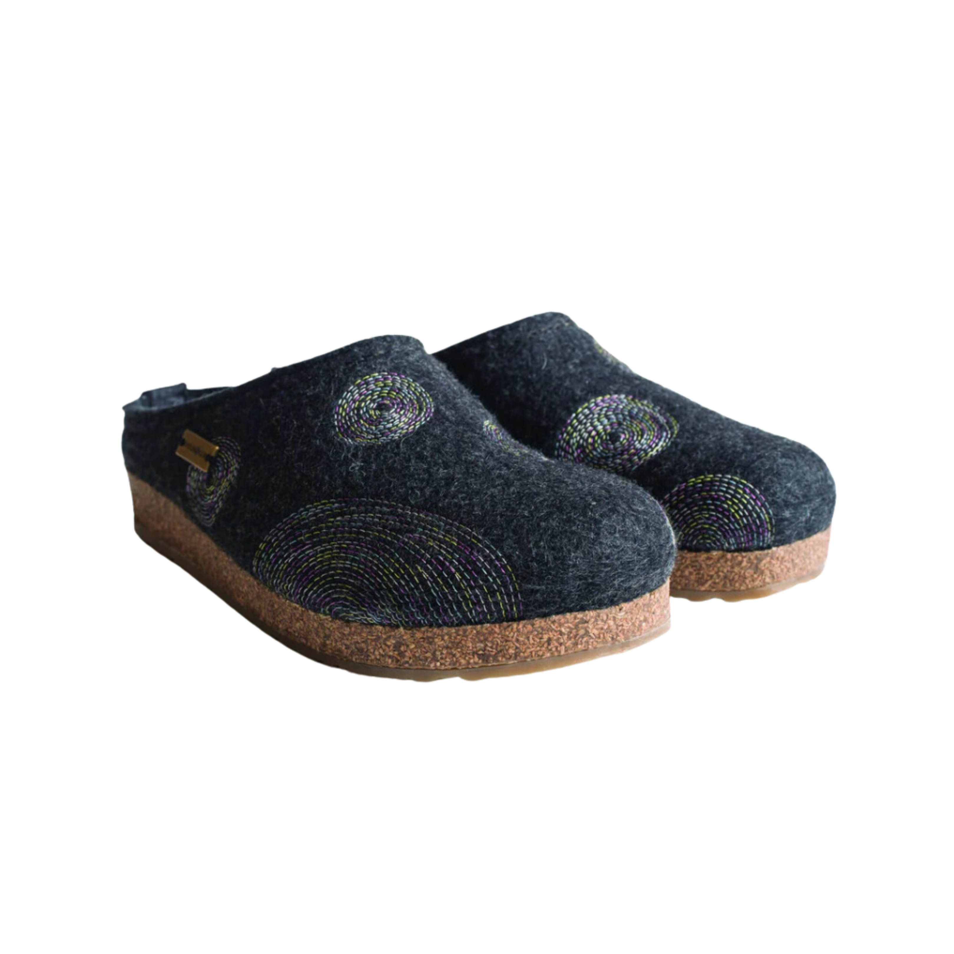 Angled view of Haflinger Women's Spirit in Navy – featuring vibrant appliqué accents on a deep navy wool base, a soft cushioned footbed, and a durable indoor sole crafted for breathable warmth and cheerful style.