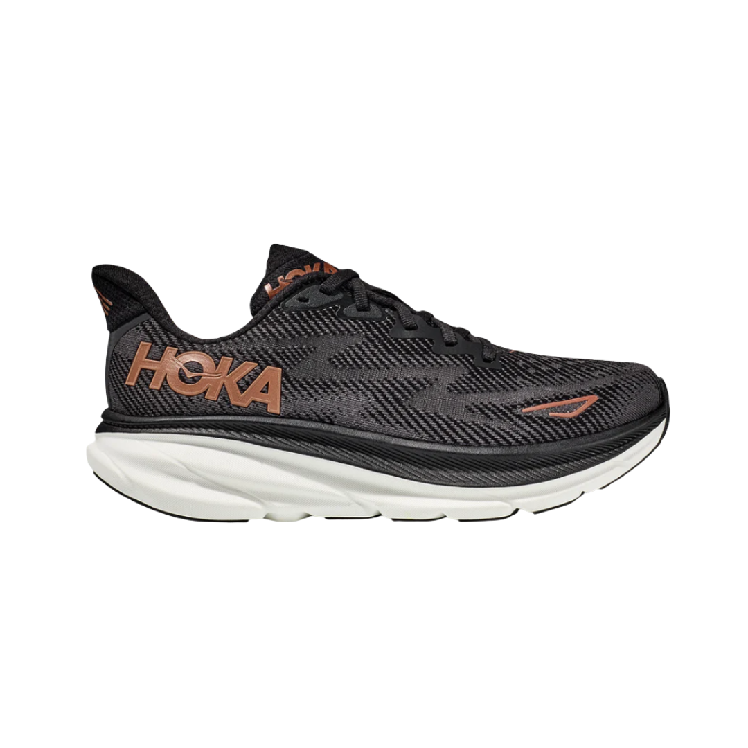 Side View of Women’s HOKA Clifton 9 Running Shoe in Black/Copper – featuring compression-molded EVA midsole for lightweight cushioning, engineered mesh upper for breathability, and early stage Meta-Rocker for smooth transitions.
