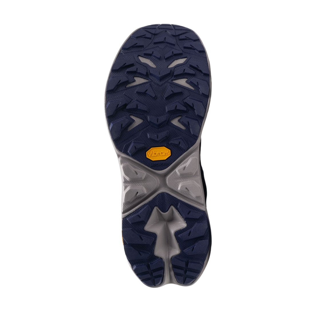 Bottom view of Women’s Anacapa 2 Mid GTX hiking boot in night sky and opal – featuring a Vibram rubber outsole with multi-directional lugs for reliable traction on varied terrain, flex grooves for natural foot movement, and slip-resistant tread to enhance stability and prevent falls.