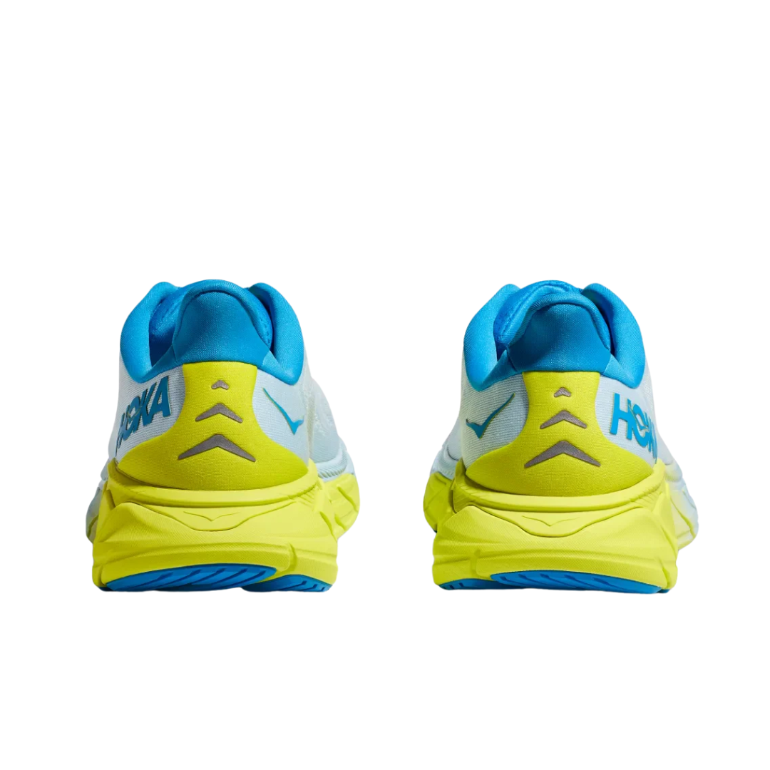 Back view of Men’s Arahi 6 running shoe in ice water and primrose – featuring molded heel counter for rearfoot stability, pull tab for easy on and off, and subtle branding details.