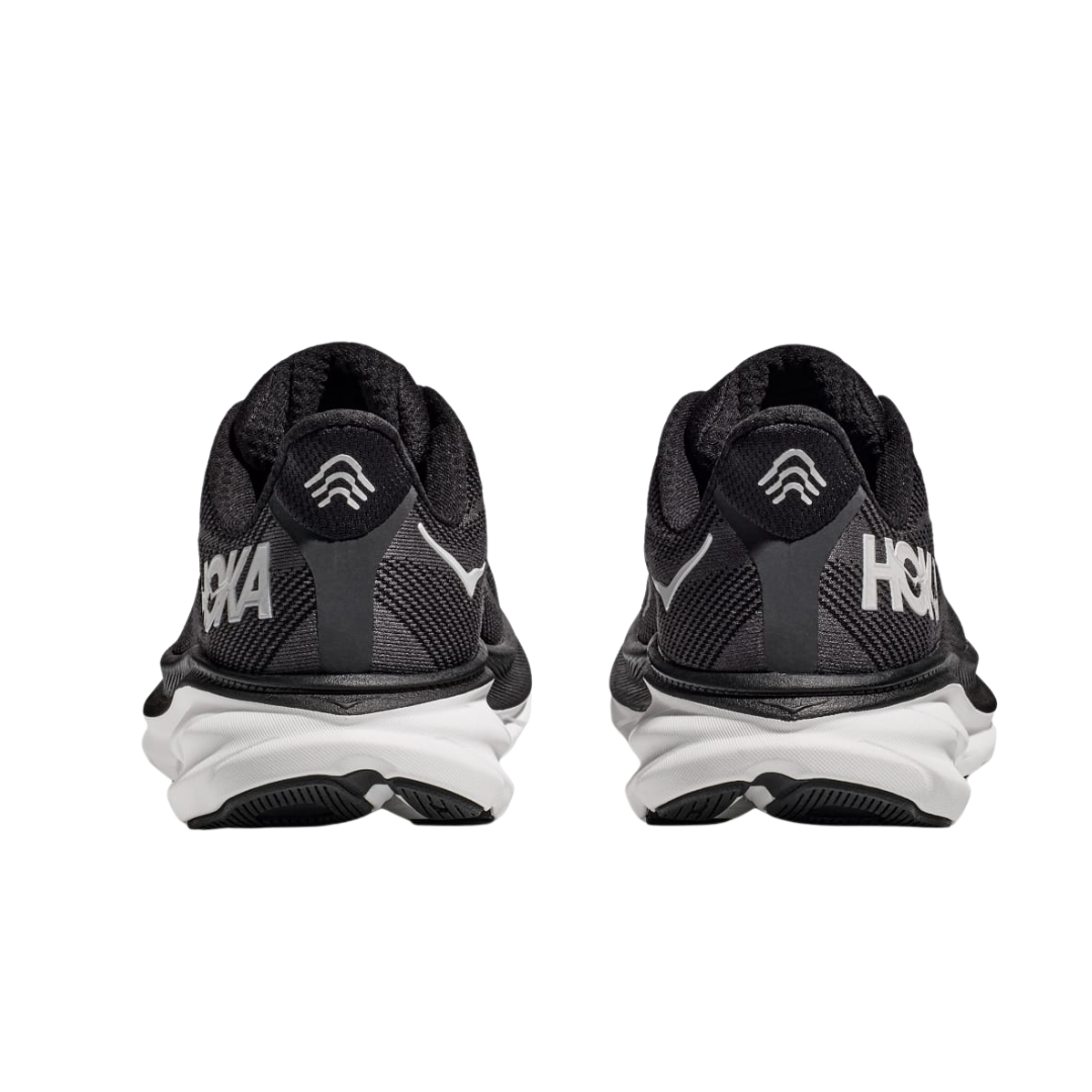 Back view of Men’s Clifton 9 running shoe in black and white – featuring molded heel counter for rearfoot stability, pull tab for easy on and off, and subtle branding details.