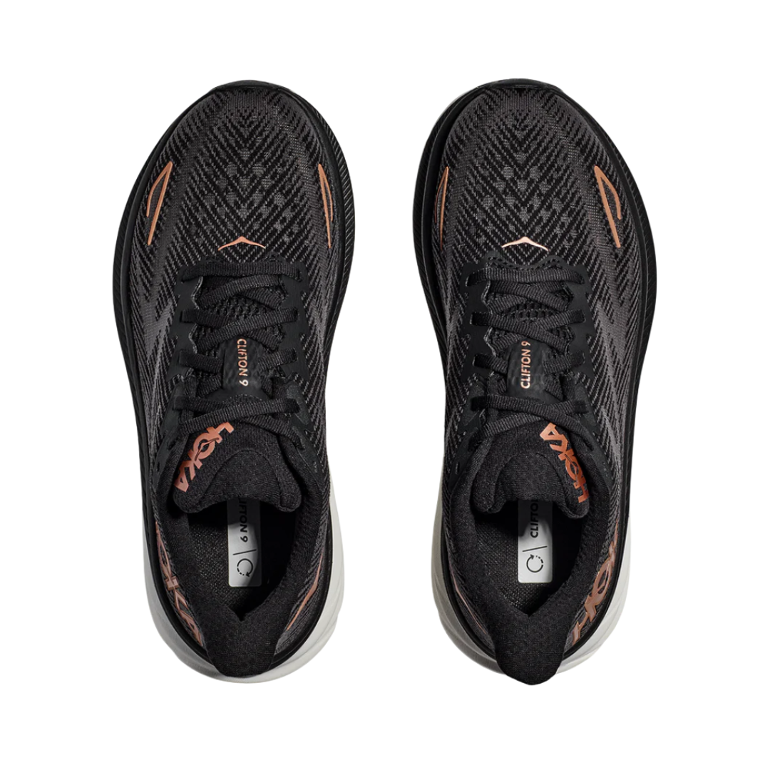 Top View of Women’s HOKA Clifton 9 Running Shoe in Black/Copper – featuring ventilated mesh upper, plush padded collar and tongue, and traditional lacing system for a secure fit.