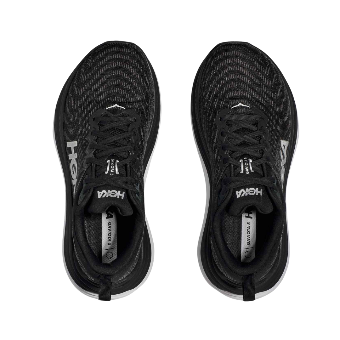 Top view of Men’s Gaviota 5 running shoe in black and white – featuring padded tongue and collar for comfort, moisture-wicking lining to keep feet dry, and secure lace-up closure for locked-in fit.