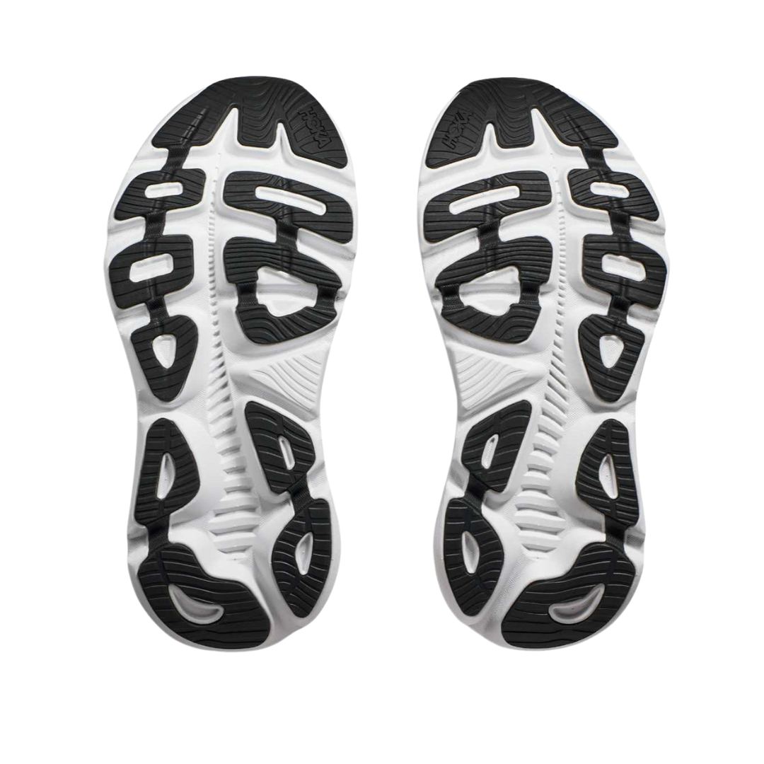 Bottom view of Women’s Gaviota 5 running shoe in black and white – featuring durable rubber outsole with segmented crash pad for smooth heel-to-toe transition, flex grooves for natural foot movement, and multi-surface traction for versatile grip.