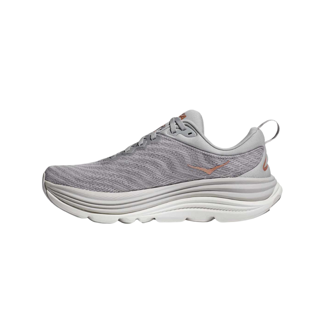 Side view of Women’s Hoka Gaviota 5 running shoe in harbor mist and rose gold – featuring engineered mesh upper for breathability, GuideRails support system for enhanced stability, and BioMoGo DNA midsole for adaptive cushioning and shock absorption.