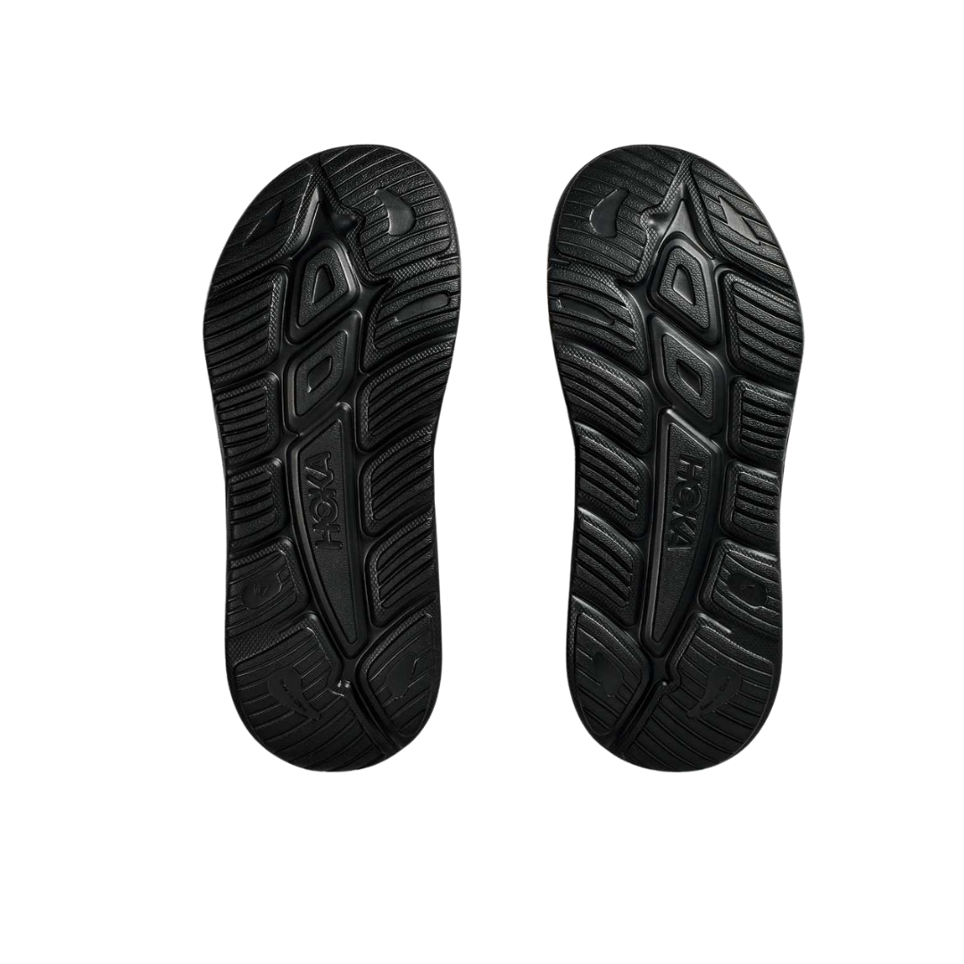 Bottom view of Unisex Ora Recovery Slide 3 in black – featuring a textured rubber outsole for slip resistance, flexible sole for natural foot movement, and durable construction for everyday use.