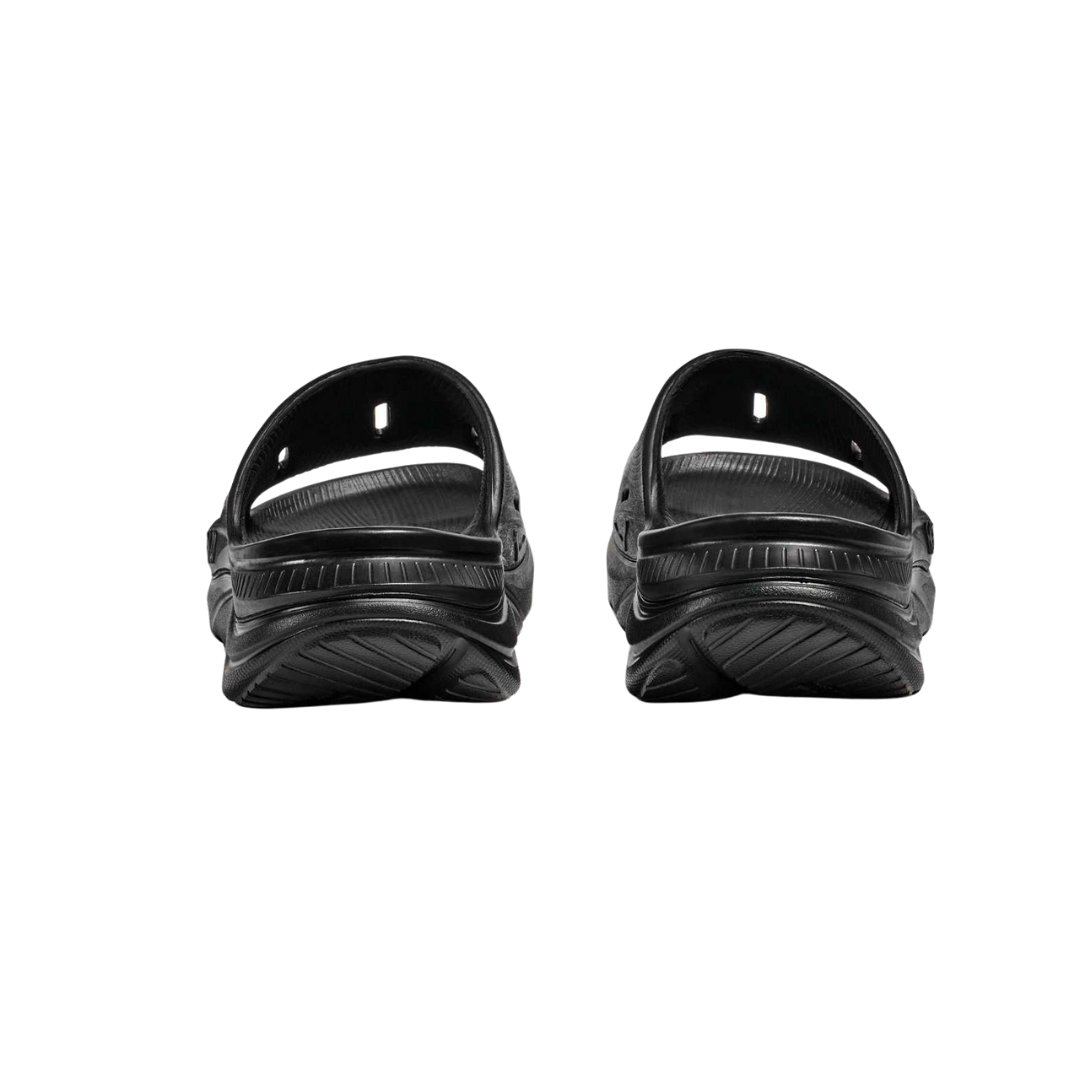Back view of Unisex Ora Recovery Slide 3 in black – featuring slightly raised heel for natural foot alignment, flexible sole for ease of movement, and durable outsole for traction.