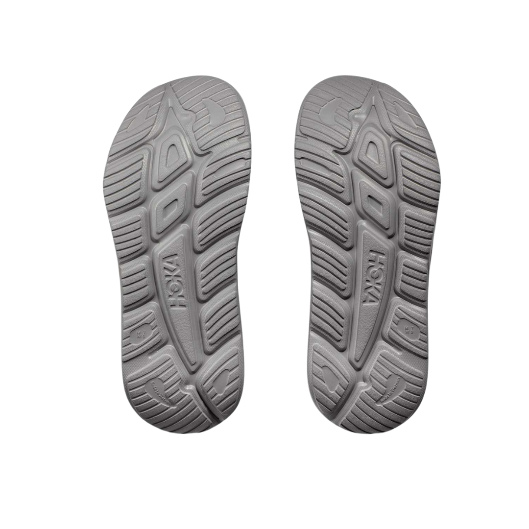 Bottom view of Unisex Ora Recovery Slide 3 in grey – featuring a textured rubber outsole for slip resistance, flexible sole for natural foot movement, and durable construction for everyday use.